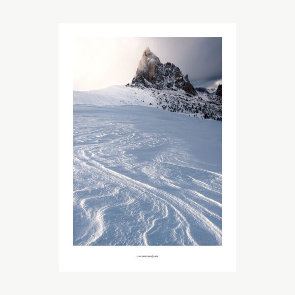 photographing a snow-covered slope below the summit of an impetuous mountain